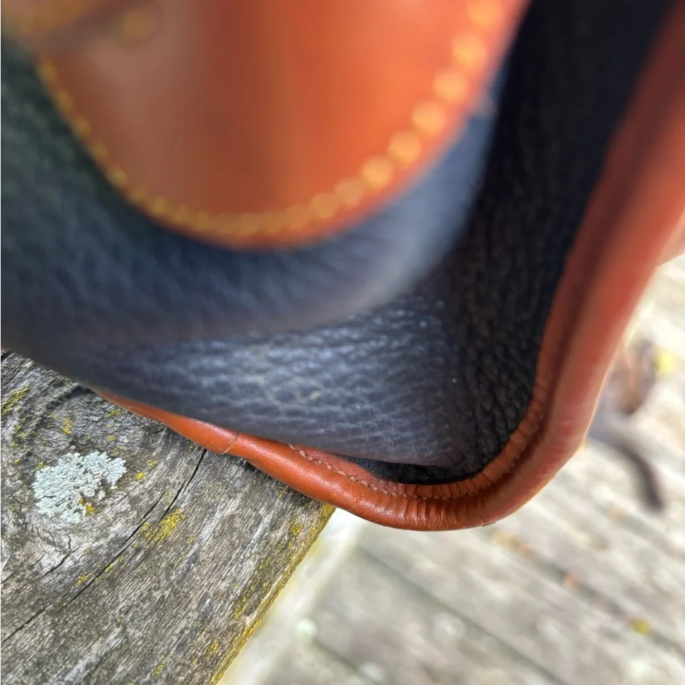 Dooney and Bourke Classic Black and Tan Vintage Leather Handbag